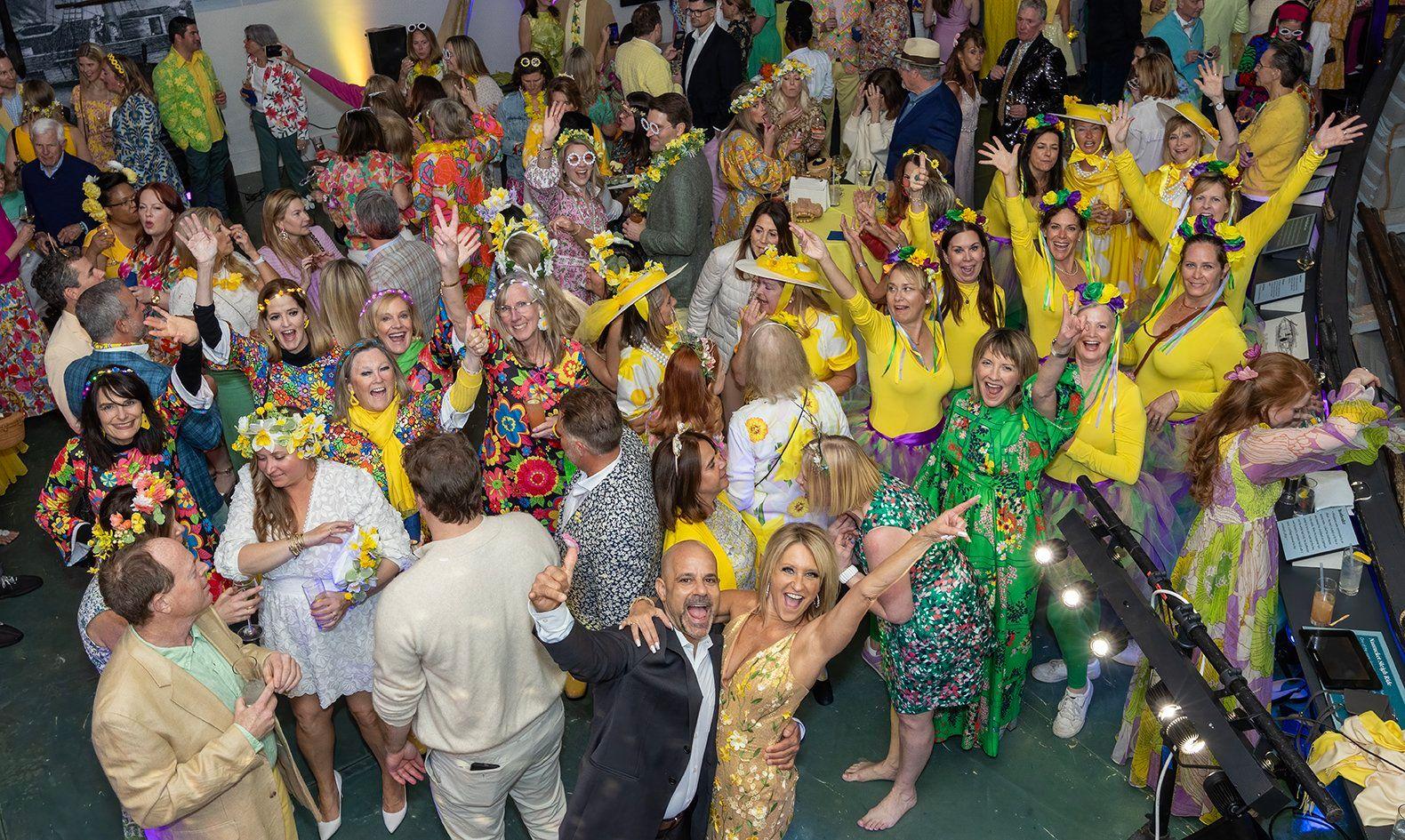 People dancing in yellow and green