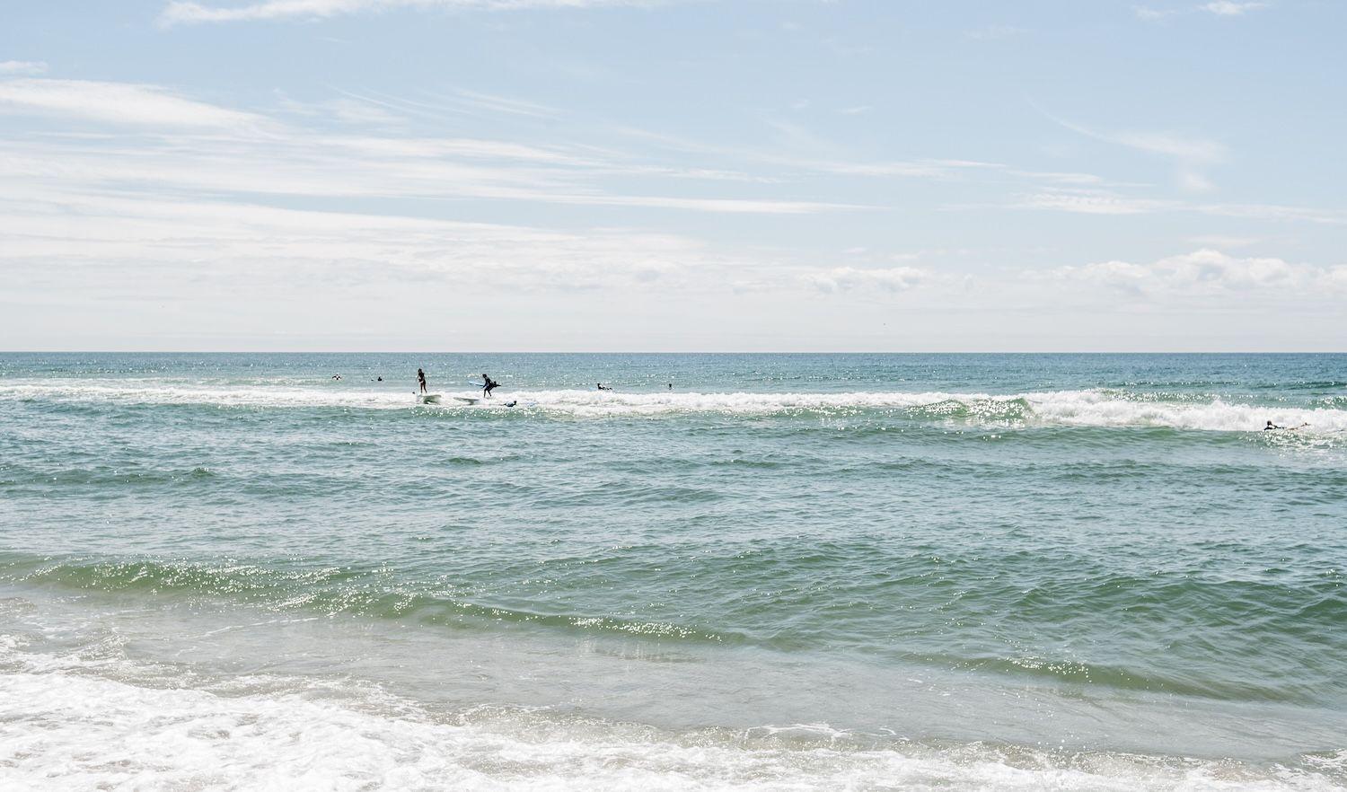 Surfers in waves.