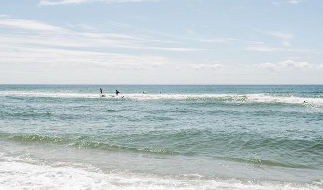 Surfers in waves.