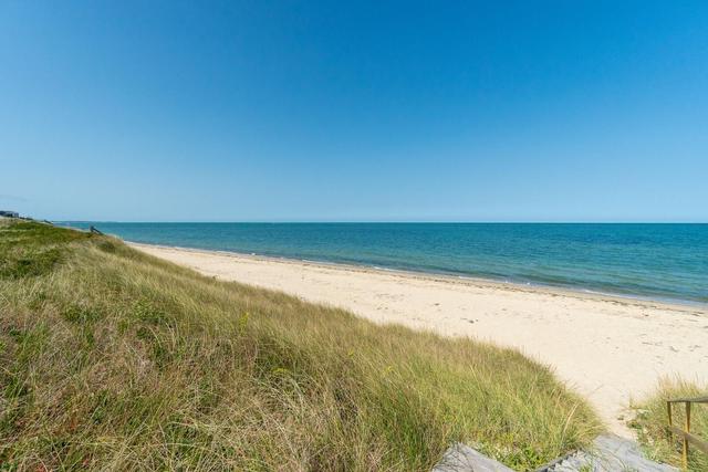 Eel Point Beach with green dunes and white sand.