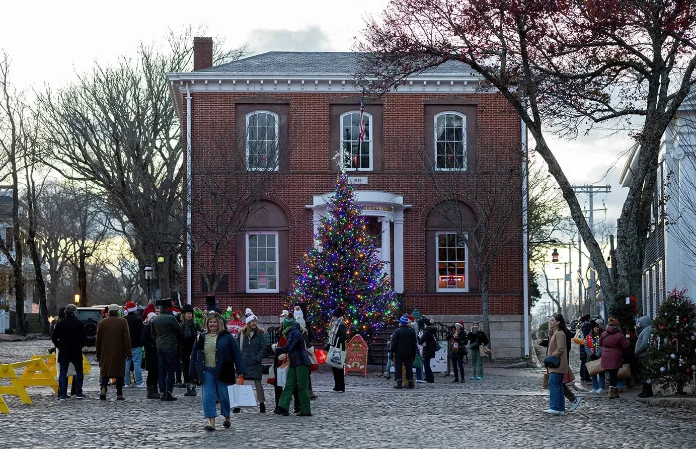 Nantucket Townhall with Christmas tree and shopper in front